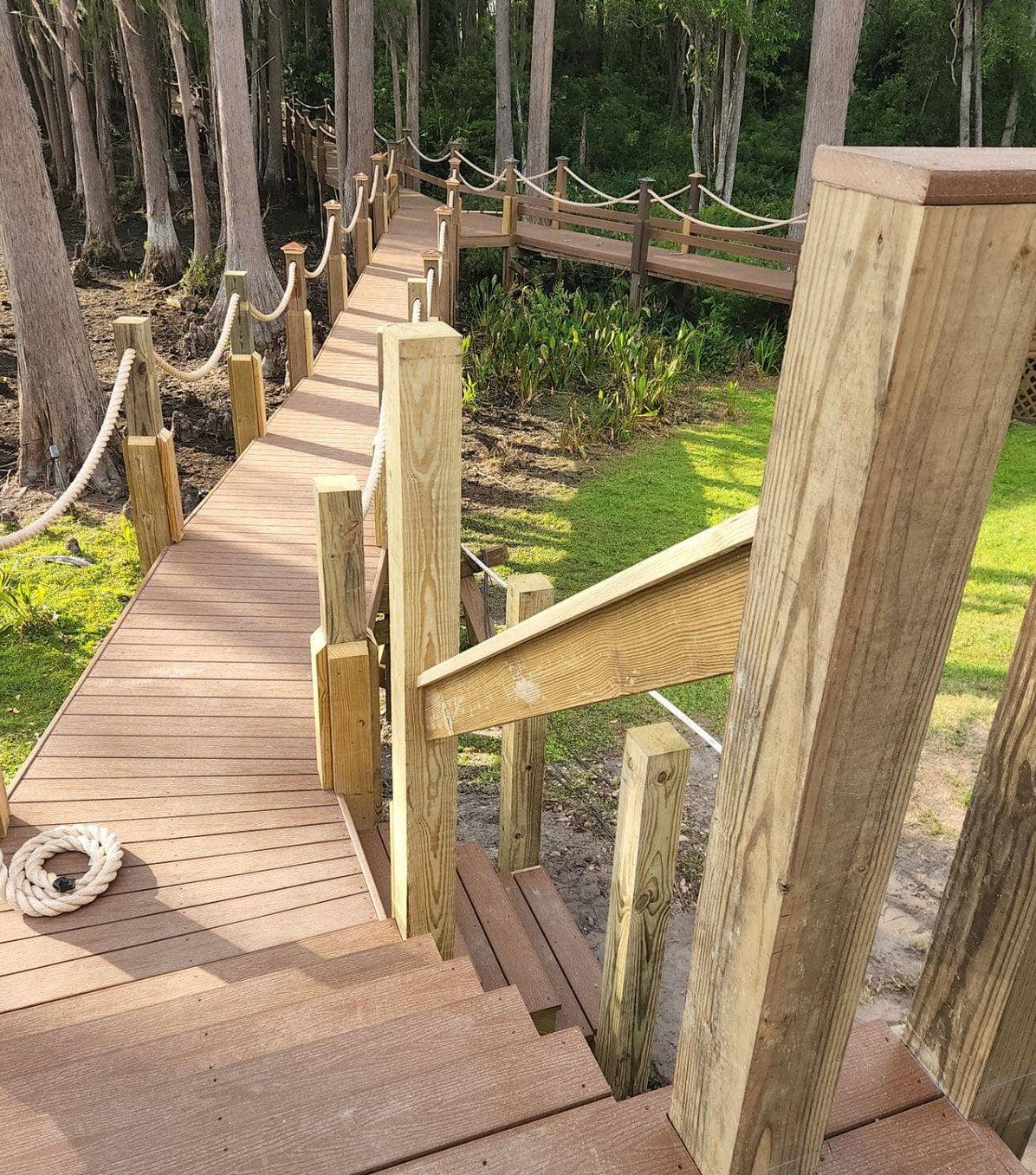 Wooden boardwalk path through waterfront property